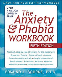 Book cover with blue sky and white fluffy clouds with title "The Anxiety & Phobia Workbook" by Edmund J. Bourne, Ph.D.